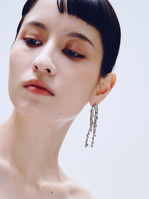 Drop Stand Earring in Silver worn on ear, close-up view |Color:Silver