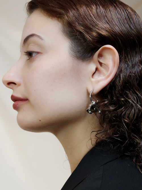 Flux Earring in Silver worn on ear, side portrait view |Color:Silver