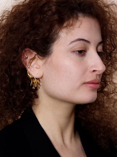 Gal Cuff in Gold worn on right ear, close-up view |Color:Gold