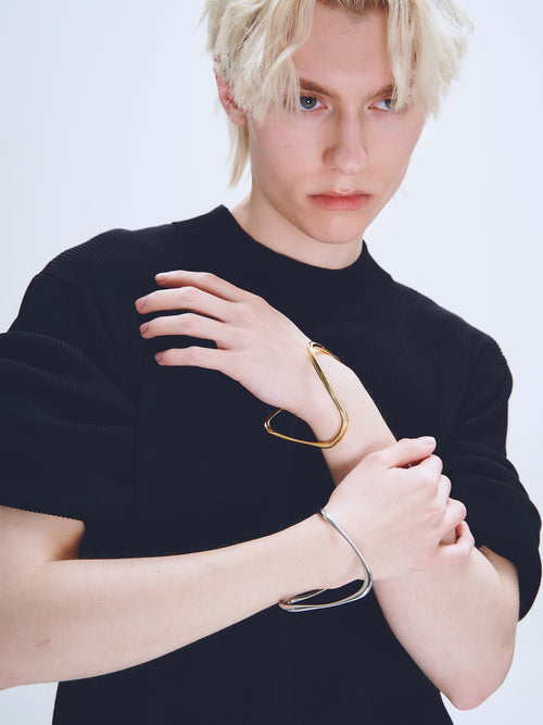 Wave Bracelet in Silver and Gold worn on wrists