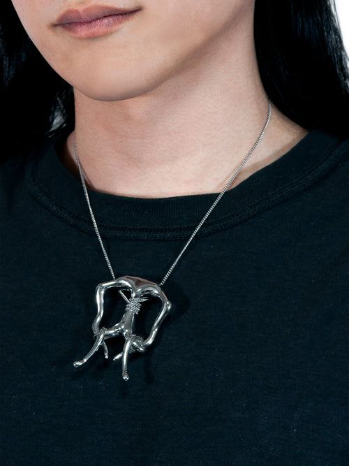 A Life Form Necklace in Silver worn around neck, angled view |Color:Silver