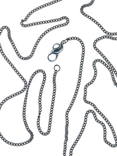 A Life Form Necklace in Silver worn around neck, detail view |Color:Silver