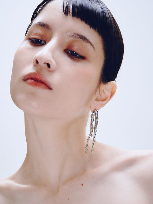 Drop Stand Earring in Silver worn on ear, front three-quarter view |Color:Silver