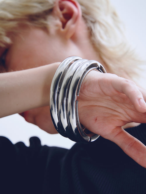 Hole Bracelet in Silver worn on wrist, alternate side view |Color:Silver