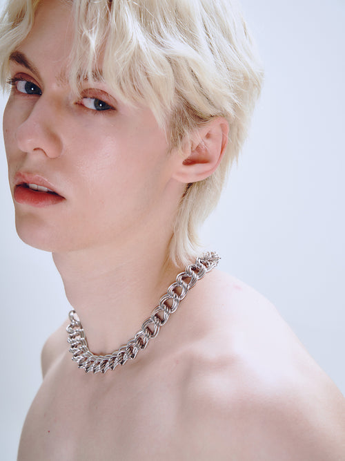 Languid Loop Necklace in Silver worn around neck, side portrait view |Color:Silver