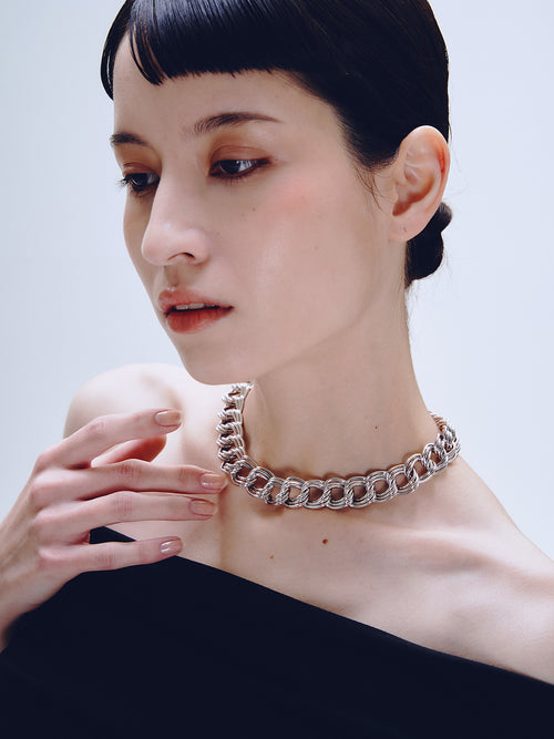 Languid Loop Necklace in Silver worn around neck, three-quarter view |Color:Silver
