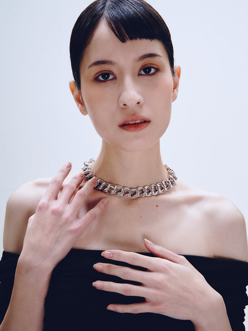 Languid Loop Necklace in Silver worn around neck, front view |Color:Silver