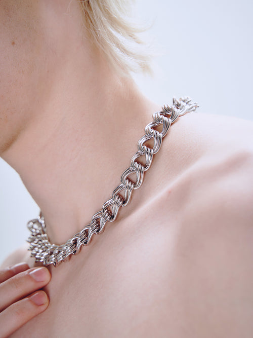 Languid Loop Necklace in Silver worn around neck, detail view |Color:Silver
