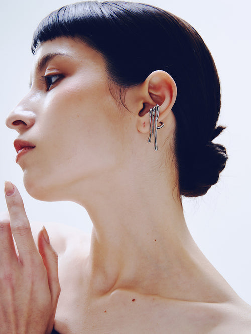 Languor Ear Cuff in Silver worn on ear, three-quarter view |Color:Silver