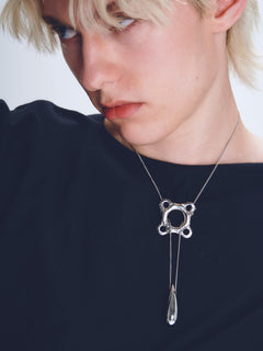 Swim Tube Necklace in Silver worn around neck, close-up view |Color:Silver