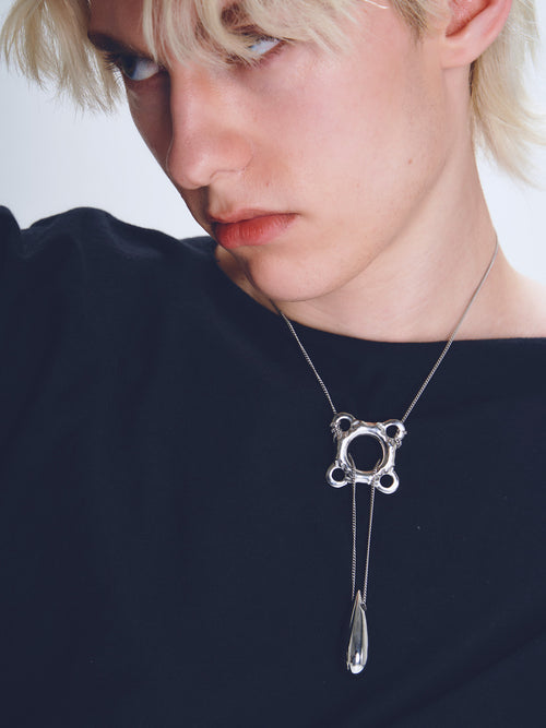 Swim Tube Necklace in Silver worn around neck, close-up view |Color:Silver
