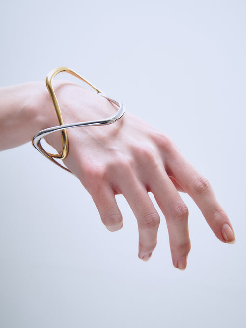 Wave Bracelet in Silver and Gold worn on hand
