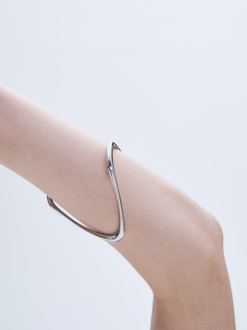 Wave Bracelet in Silver worn on wrist, close-up view |Color:Silver